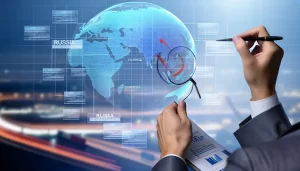 Aerial view of a shipping port with containers and cargo ships.